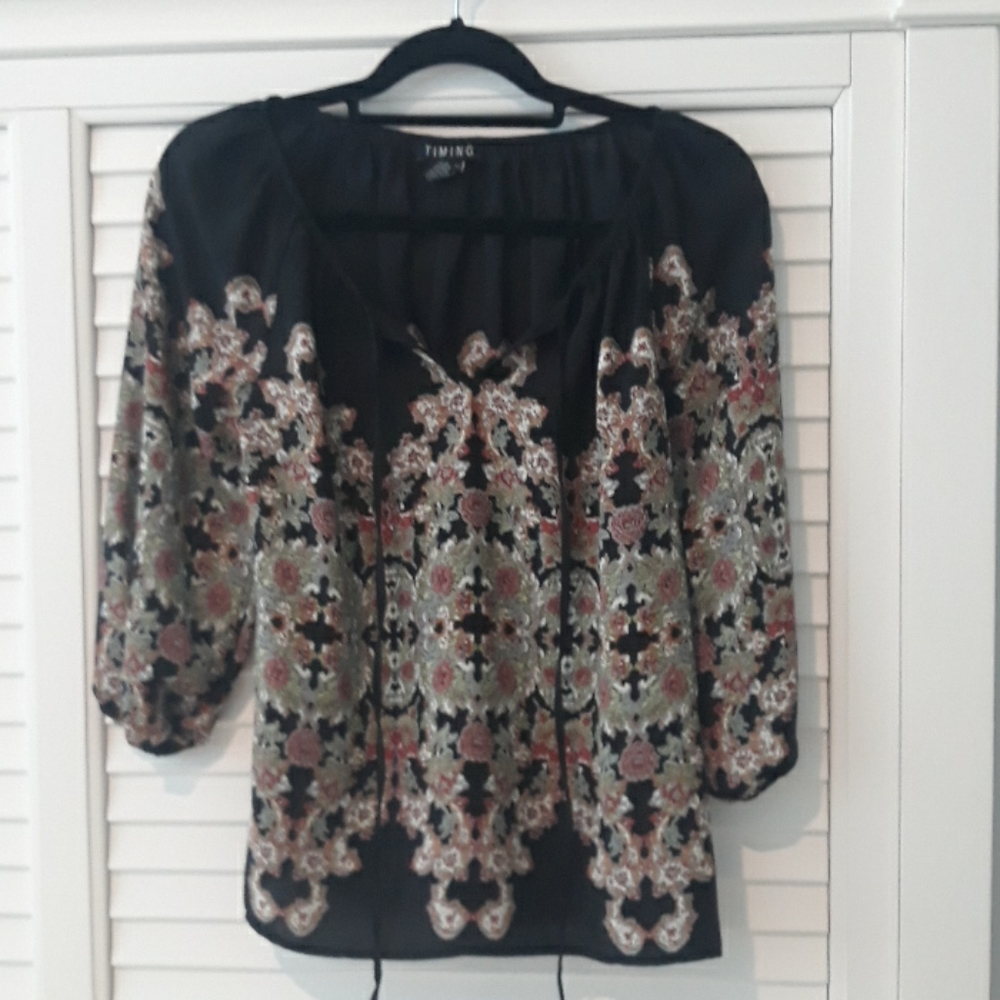 A TIMING blouse with 3/4 length sleeved in s rich mosaic print on black.
